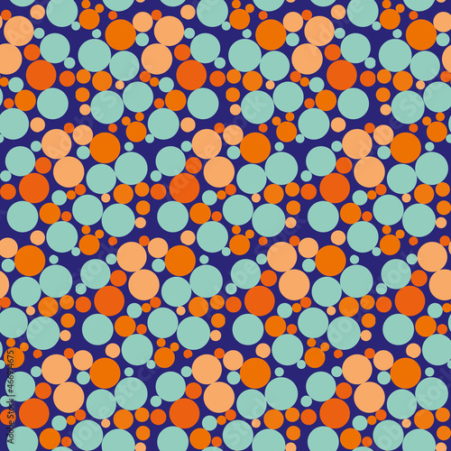 Abstract bubble hexagon vector seamless pattern background. Funky backdrop with honeycome style circles in neon orange, blue, indigo. Geometric repeat with varied bubbles. All over print for summer
