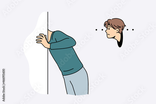 Prying and curiosity interest concept. Young interested man cartoon character standing looking from aside putting head into other vector illustration 