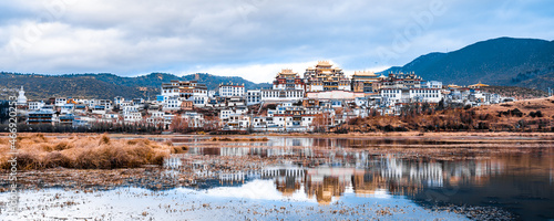 Reflection on the lake of Songzanlin Temple in Shangri-La, Yunnan, China