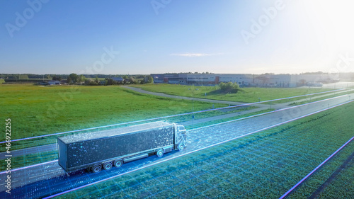Futuristic High-Tech Concept: Big Semi Truck with Cargo Trailer Drives on the Road is Transformed with Graphics Special Effects Into Digitalized Advanced Autonomous Truck Concept. Aerial Drone Shot