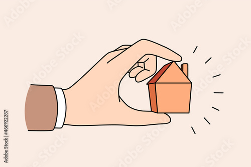 Real estate and apartment concept. Human hand holding little tine house apartment for sale or rent vector illustration 
