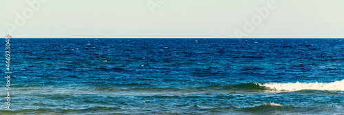 horizontal line of blue sea and sand beach calming view of nature panorama