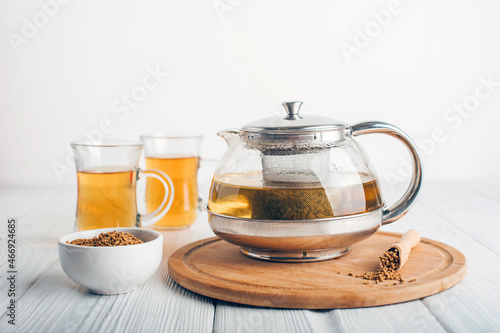 Tableau sur toile Superfood Taiwan Ku Qiao buckwheat tea in teapot and transparent cups close-up and copy space