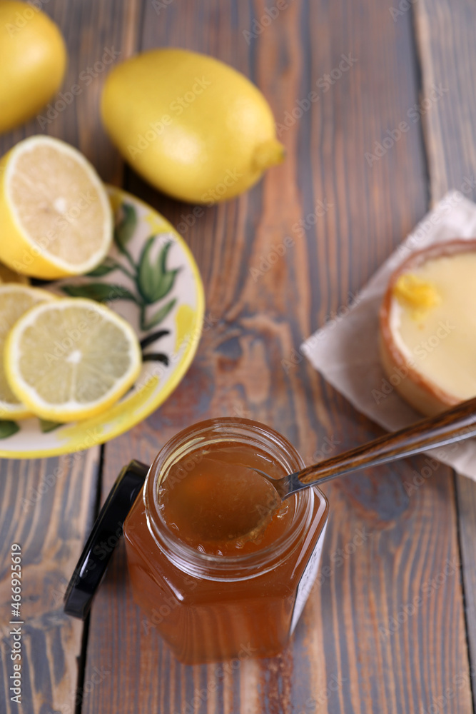 Lemon jam in a glass jar and other lemon desserts Lemon jam in a glass jar and other lemon desserts
