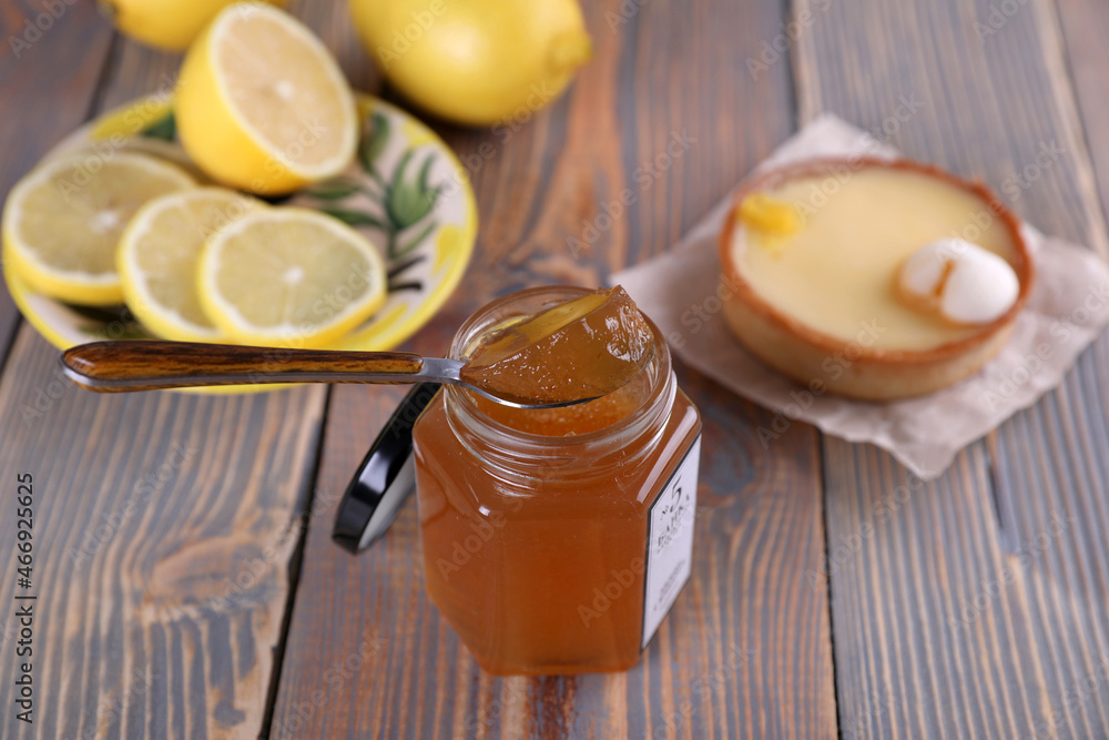 Lemon jam in a glass jar and other lemon desserts Lemon jam in a glass jar and other lemon desserts