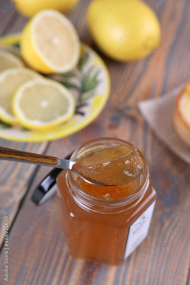 Lemon jam in a glass jar and other lemon desserts Lemon jam in a glass jar and other lemon desserts