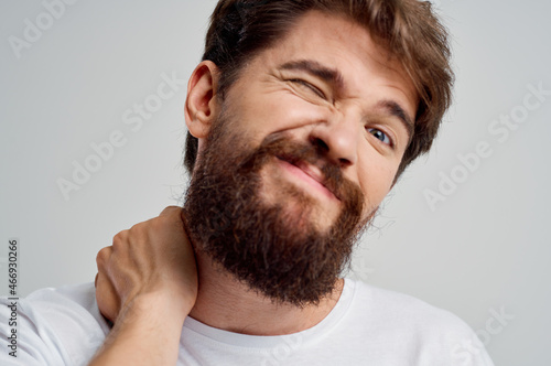 emotional man holding neck arthritis health problems isolated background