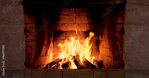 The fire is burning in the fireplace photo