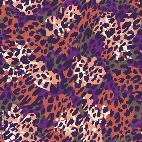 Seamless pattern made of leopard spots skin texture mixed with large colorful brush strokes background. Spotted sophisticated ornament. Fashion style. Good for wrapping, textile and fabric.