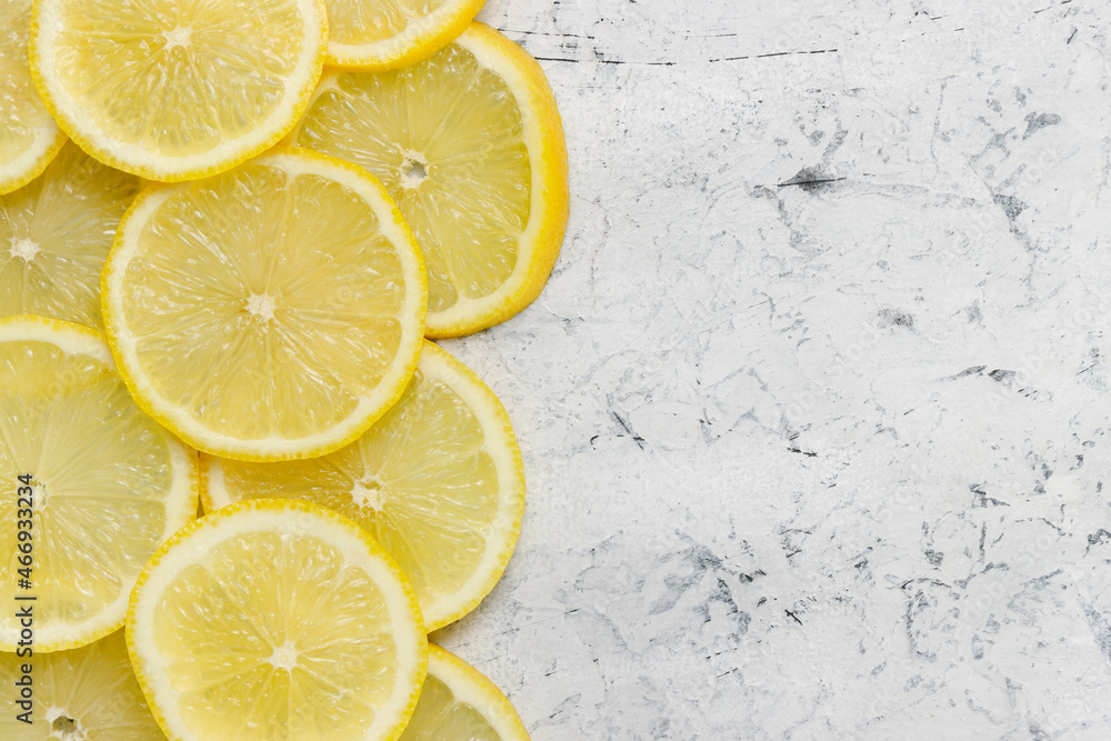 Sliced lemons background with copy space. Top view of lemons with empty space on concrete background Sliced lemons background with copy space. Top view of lemons with empty space on concrete background