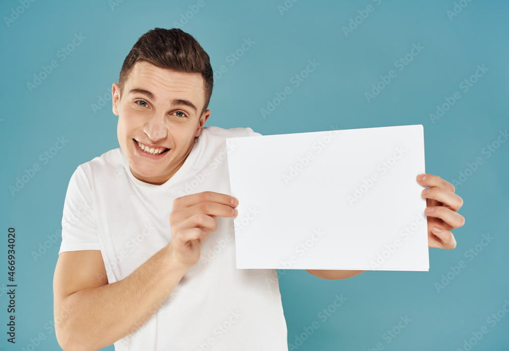 man in white t-shirt white sheet copy-space advertising blue background man in white t-shirt white sheet copy-space advertising blue background