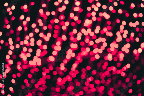Blurred Christmas background of red lights, defocus bokeh image.