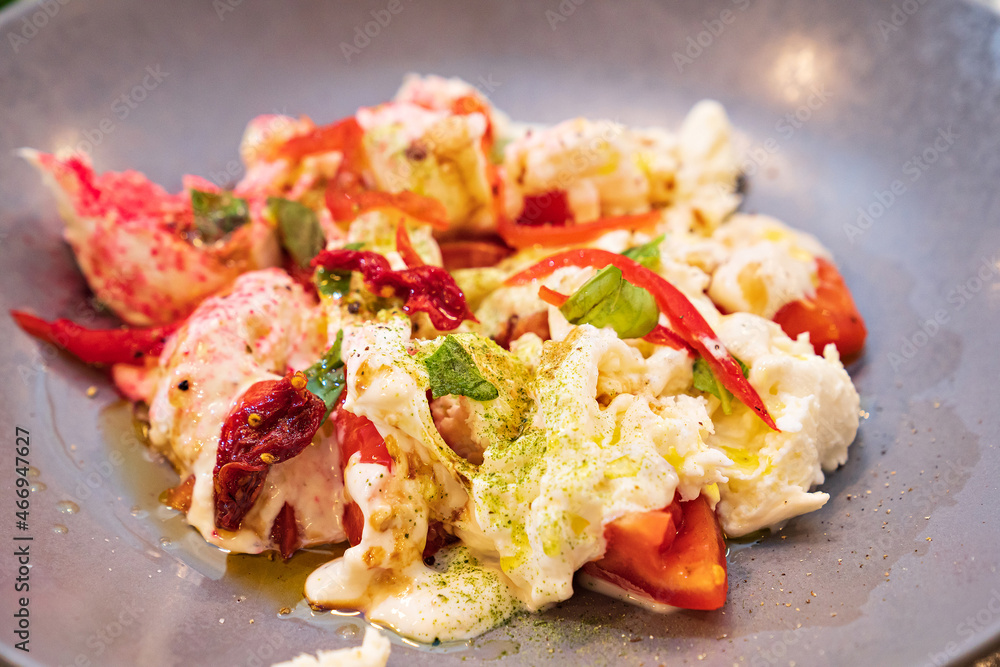 salad with crabs on a gray plate. seafood dish. menu in the restaurant. salad with crabs on a gray plate. seafood dish. menu in the restaurant.