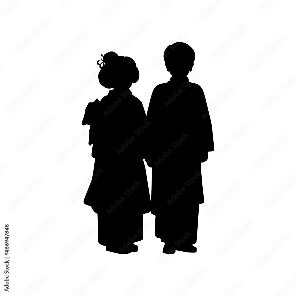 Silhouette of boy and girl in national asian costume.