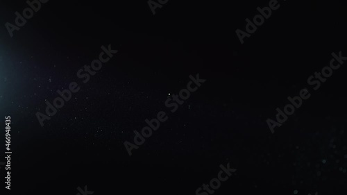 Natural Dust Organic Floating particles in stage light ray (spot) on black background. Dust in air atmosphere for your projects! Just drop it over your footage and use blending (screen) mode.