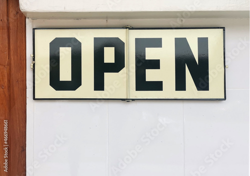 shop open sign on wall