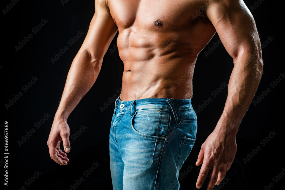 Sexy guy man on black. Handsome fitness young bodybuilder with naked torso. Nude man torso. Sexy