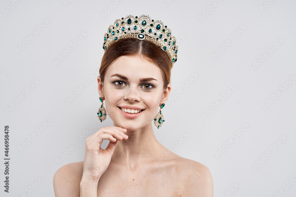 portrait of a woman with a crown on her head makeup model isolated background portrait of a woman with a crown on her head makeup model isolated background