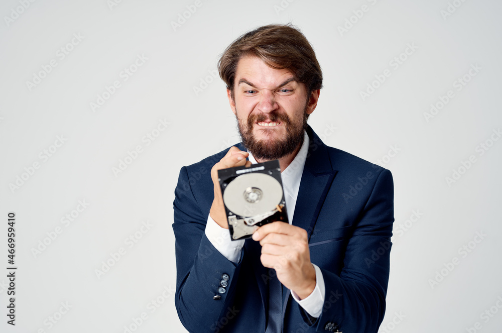 business man in suit hard drive information data recovery business man in suit hard drive information data recovery