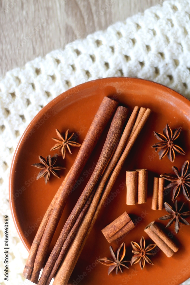 Plate of various winter spices and knitted blanket. Flat lay. Plate of various winter spices and knitted blanket. Flat lay.