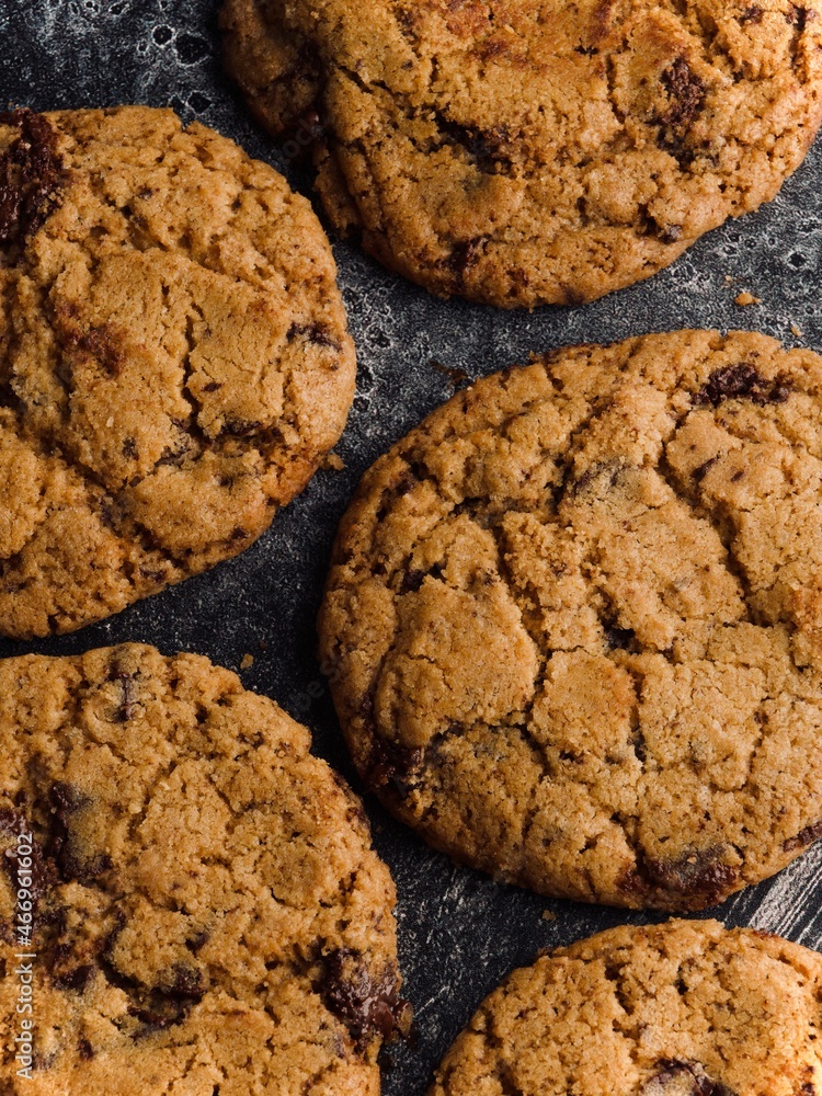 chocolate chip cookies on a stone surface chocolate chip cookies on a stone surface