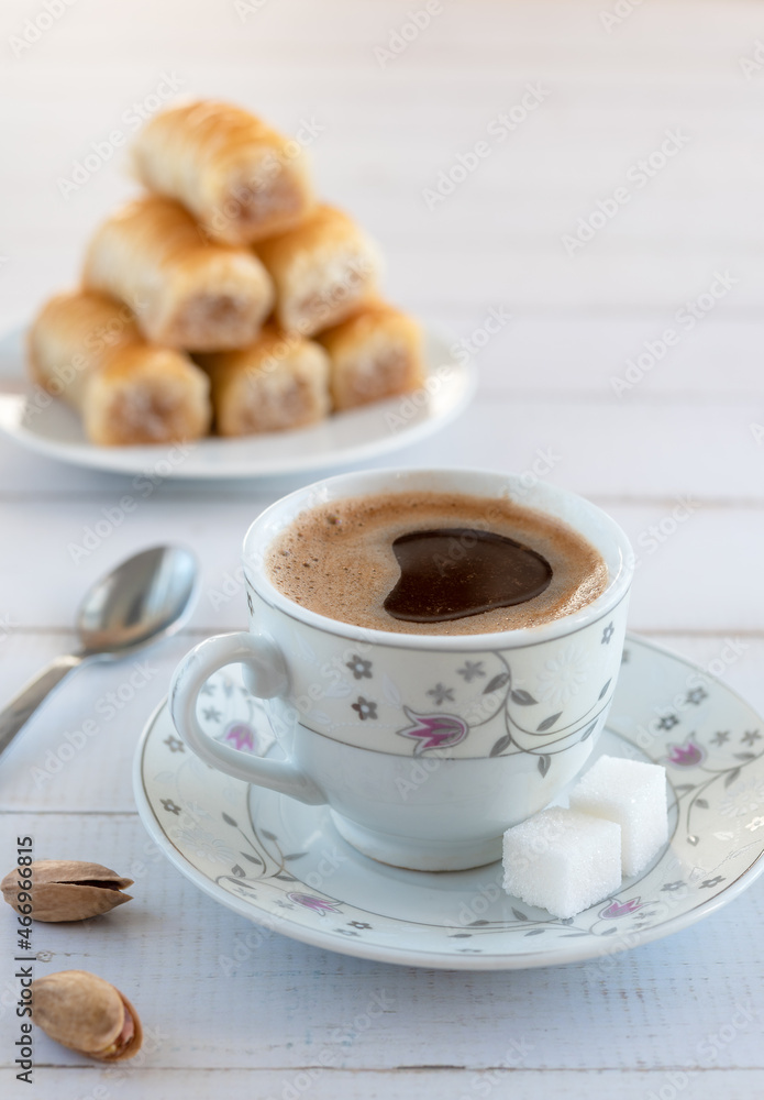 A cup of Turkish coffee and traditional sweetness - baklava. A cup of Turkish coffee and traditional sweetness - baklava.