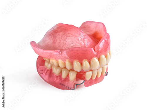 Acrylic denture isolated on a white background photo
