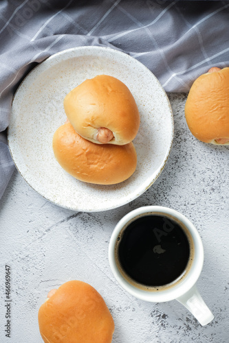 Sausage bun and coffee with white background