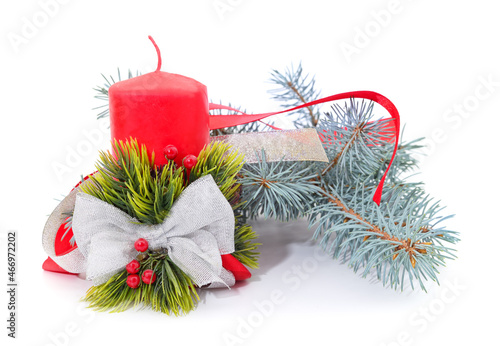 Blue branches of pine with a Christmas candle.