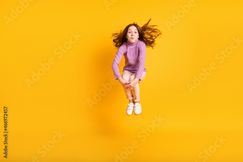 Fototapeta Naklejka Na Ścianę i Meble -  Full size photo of funky funny pretty beautiful girl jumping hold breath fooling around isolated on yellow color background