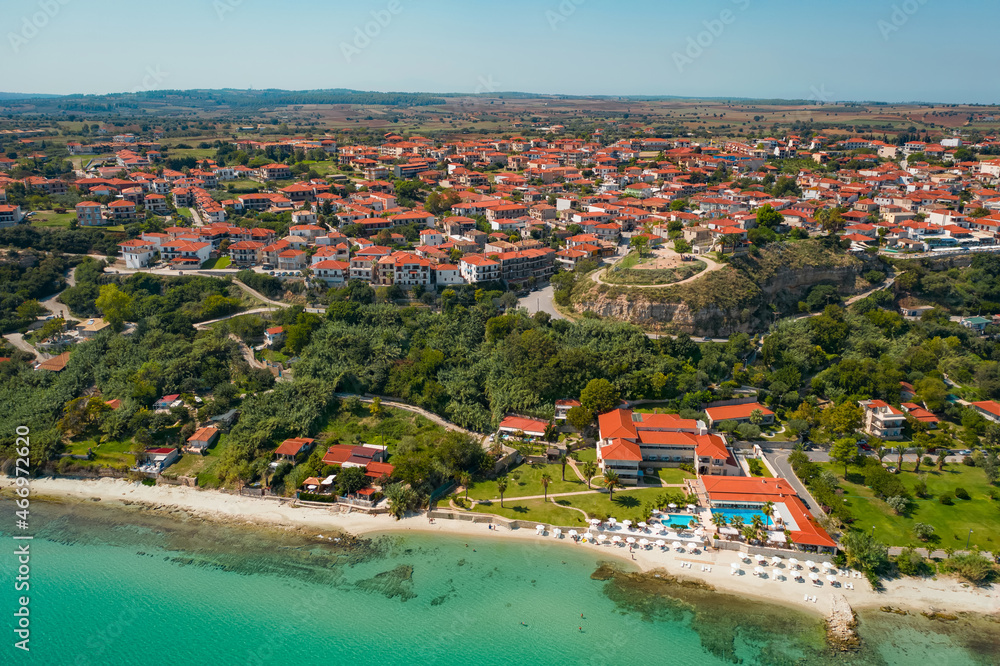 Afytos village in Chalkidiki, northern Greece. Aerial drone view of old city and orange roofs and beach. Kassandra peninsula