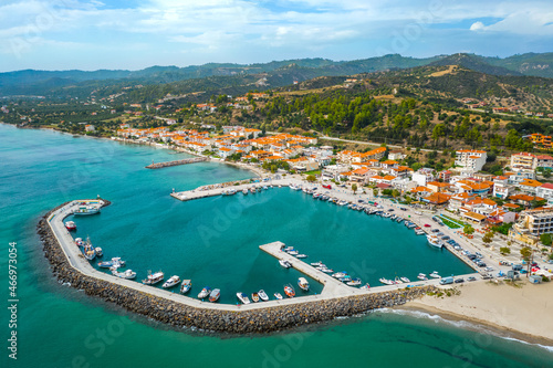 Typical greek village Nea Skioni, beach, orange roofs, mountain. Halkidiki, Greece