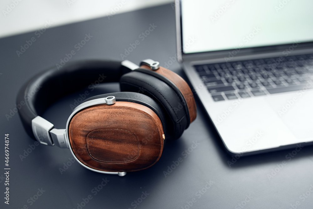 headphones on the table laptop technology