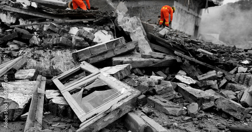 Search and rescue forces searching through a destroyed building
