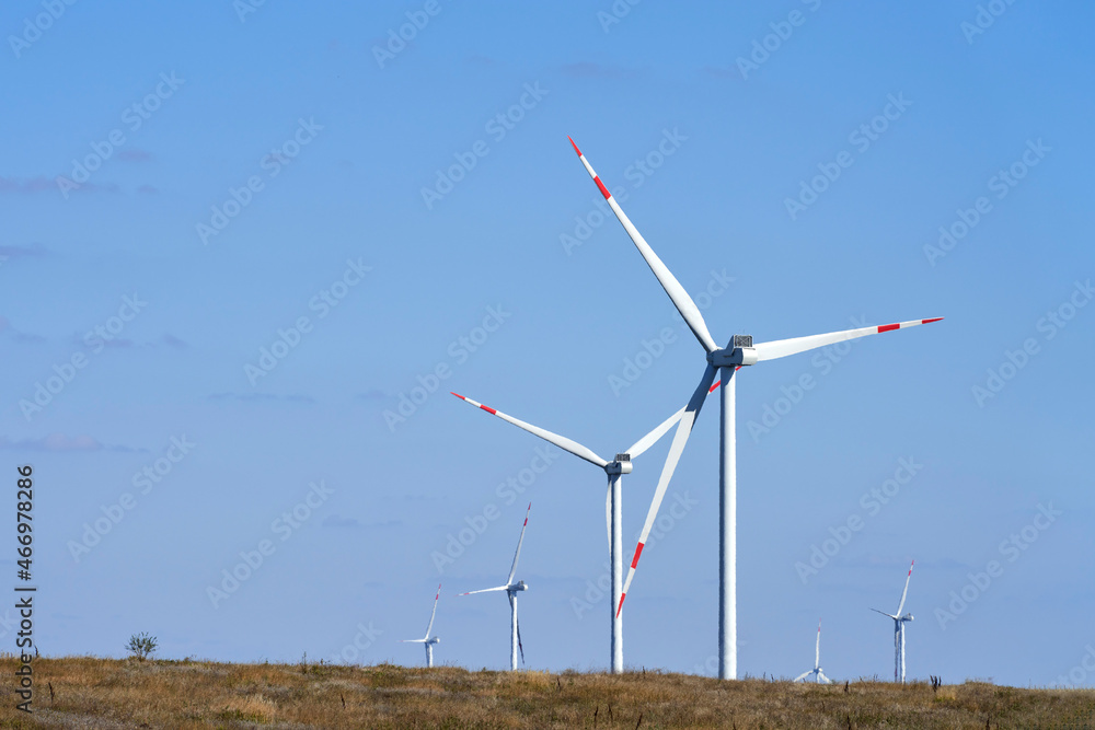 A wind farm in the steppe. Selective focus. Copy space. A wind farm in the steppe. Selective focus. Copy space.