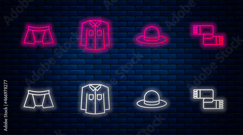 Set line Shirt, Man hat, Men underpants and Winter scarf. Glowing neon icon on brick wall. Vector