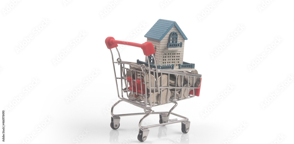 Toy shopping cart with Model of house on coins and delivery concept Toy shopping cart with Model of house on coins and delivery concept