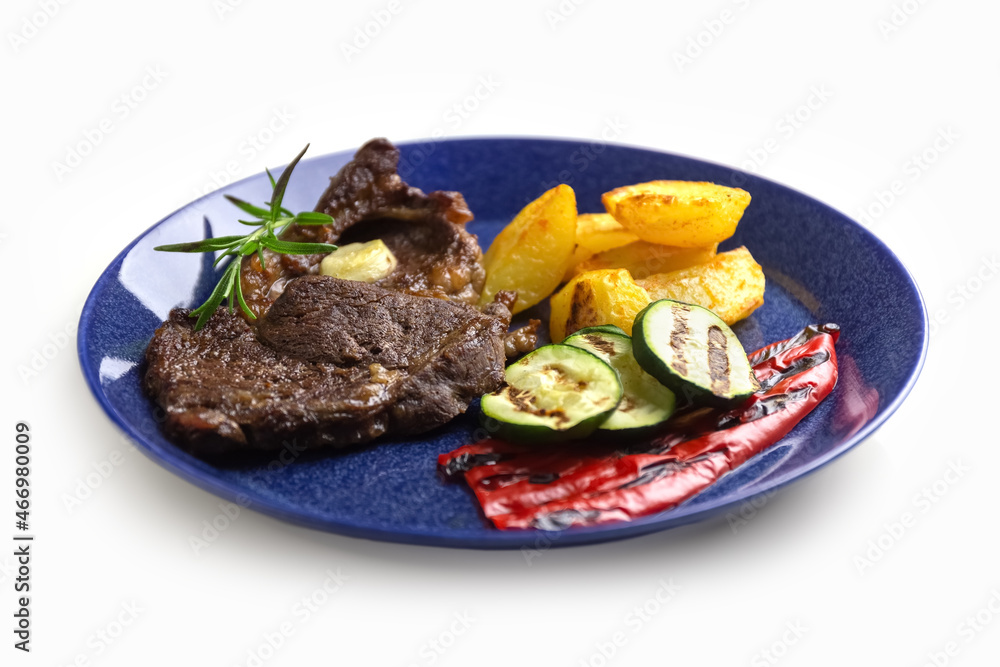 Grilled vegetables and beef steak on a plate. Delicious and healthy food. Isolate. Photo Grilled vegetables and beef steak on a plate. Delicious and healthy food. Isolate. Photo