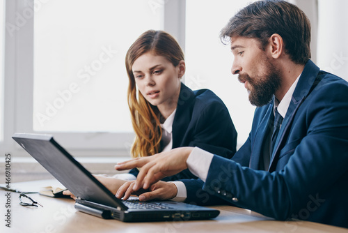  managers in the office in front of a laptop career work technologies