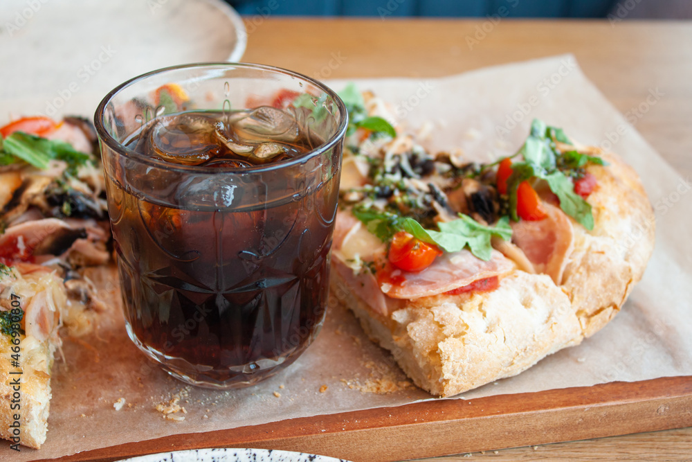 Delicious italian pizza with cola soda with ice. Delicious italian pizza with cola soda with ice.