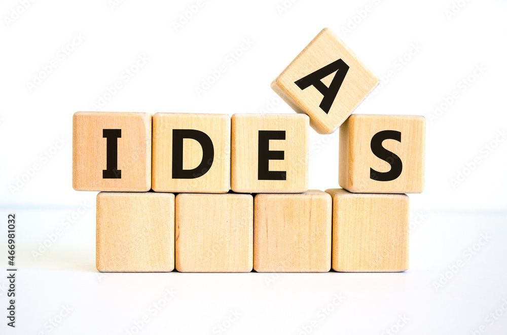 Ideas symbol. The concept word 'ideas' on wooden cubes on a beautiful white table. White background. Business and idea or ideas concept. Ideas symbol. The concept word 'ideas' on wooden cubes on a beautiful white table. White background. Business and idea or ideas concept.