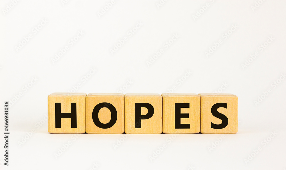 Hopes symbol. The concept word 'hopes' on wooden cubes. Beautiful white table, white background, copy space. Business, psychological and hope and hopes concept. Hopes symbol. The concept word 'hopes' on wooden cubes. Beautiful white table, white background, copy space. Business, psychological and hope and hopes concept.