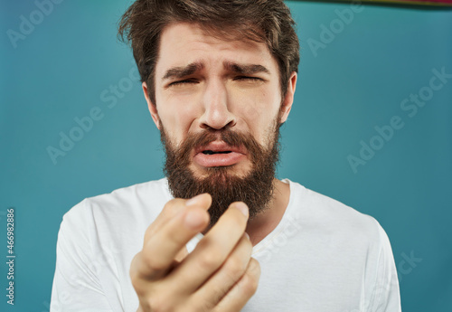 Man in a white t-shirt hand gestures anger Lifestyle