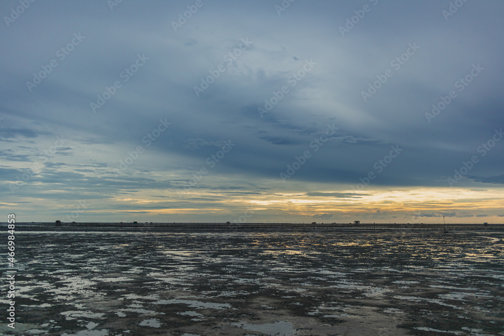 Low tide showing big area of mud sea in the evening.