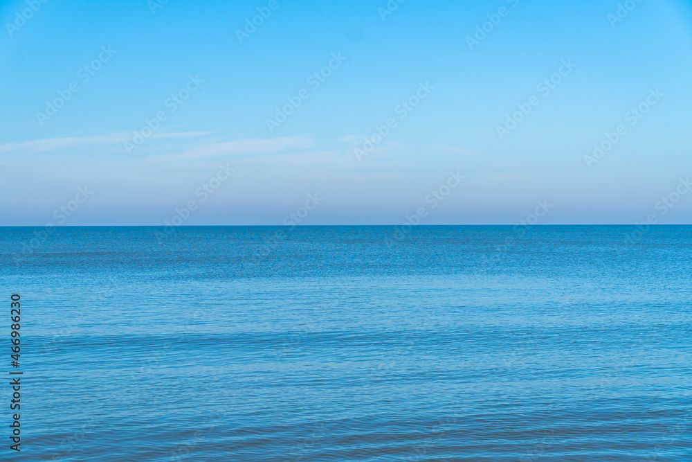calm blue sea on an autumn sunny day close up