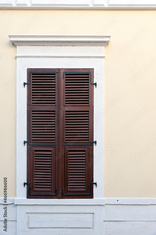 House with closed shutters stock photo