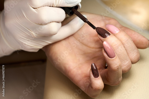 Woman doing manicure for herself. High quality photo