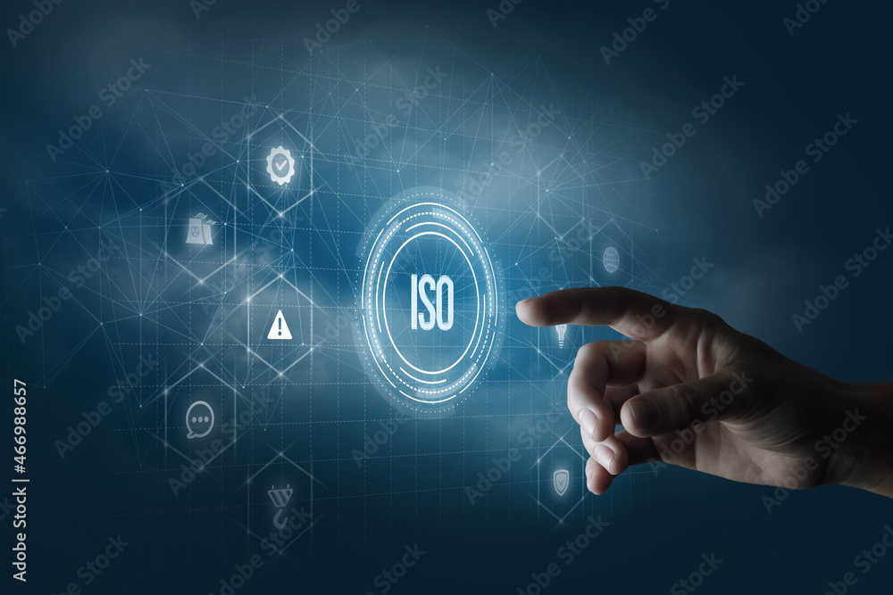 Hand clicks on an iso standards interface . Stock Photo | Adobe Stock