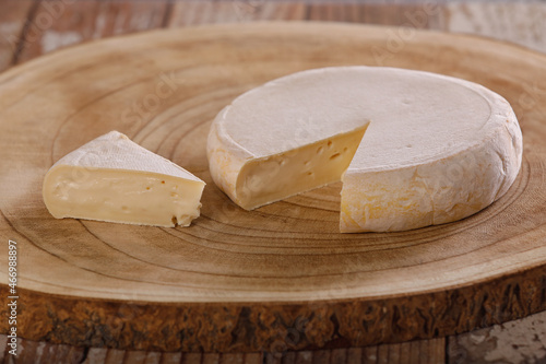 Reblochon cheese on a wooden background