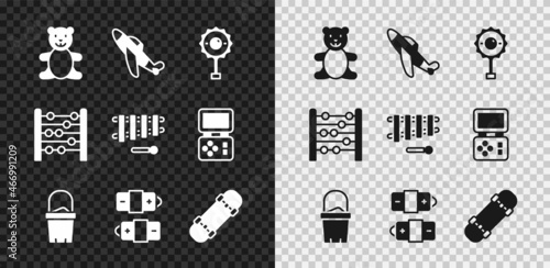 Set Teddy bear plush toy, Toy plane, Rattle baby, Sand in bucket, Battery, Skateboard, Abacus and Xylophone icon. Vector